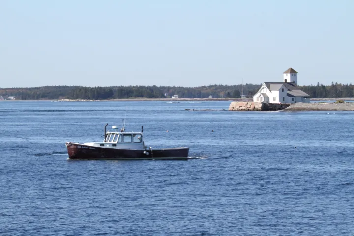 a small boat in a body of water