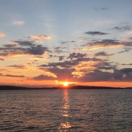 a sunset over a body of water