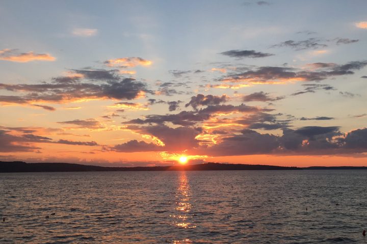 a sunset over a body of water