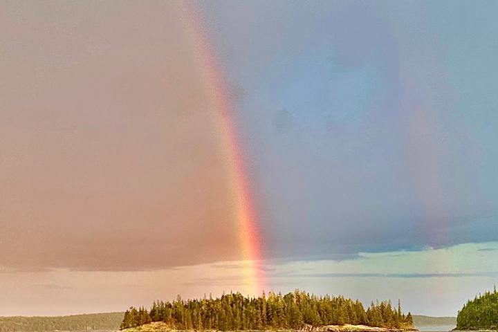 a rainbow over a body of water