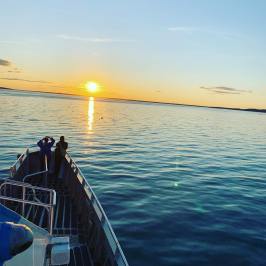 a boat is docked next to a body of water