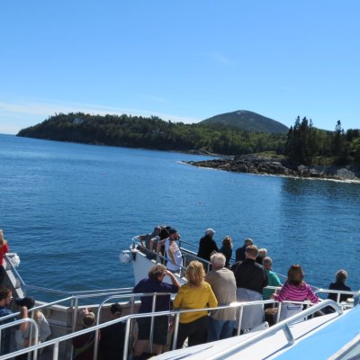 a group of people in a boat on a body of water