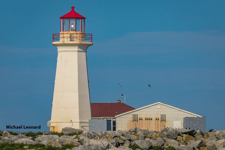 a small clock tower in front of a house