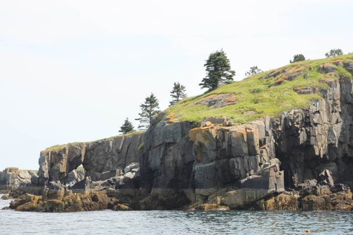a rocky island in the middle of a large rock
