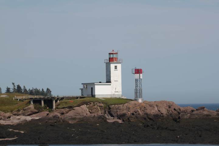 a tower with a mountain in the background
