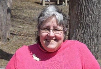 a person sitting at a zoo