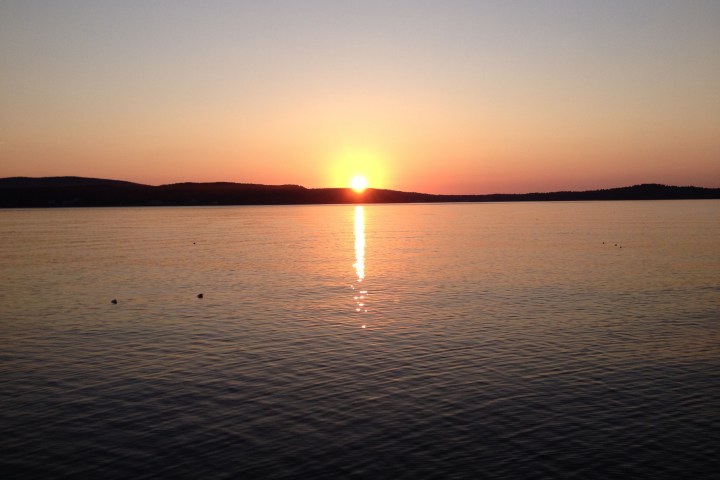 a sunset over a body of water